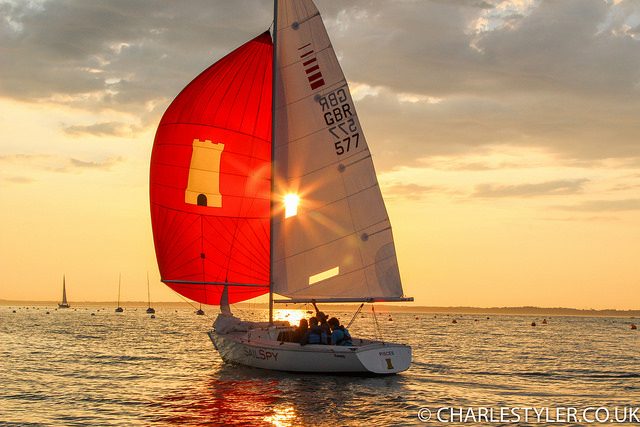 Red spinnaker glowing at sunset