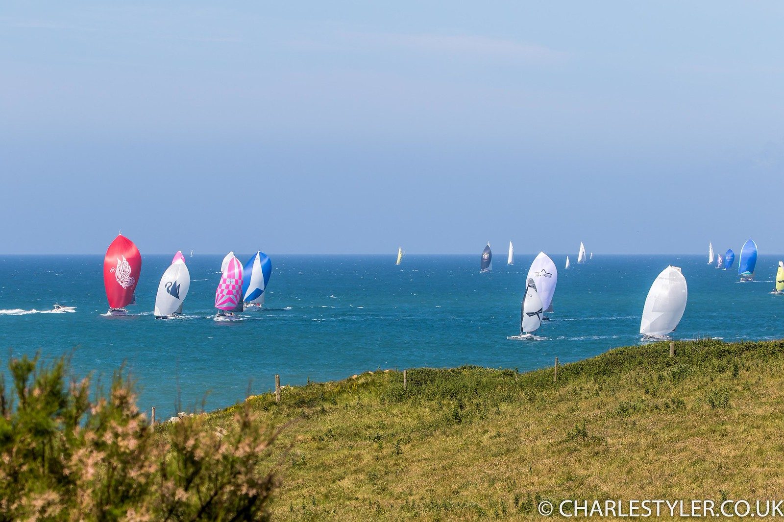 Spinnakers filled with wind during the Round the Island Race off the Isle of Wight