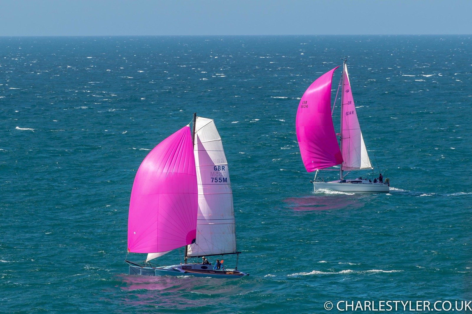 Yacht with pink spinnaker