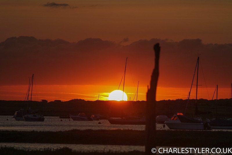 Sun dropping below the dunes